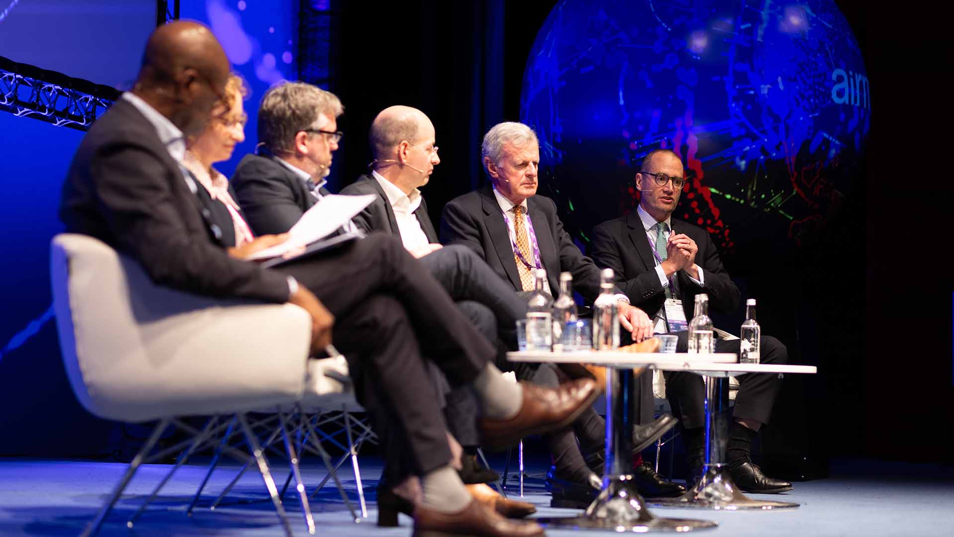 Group playing game at a conference stand