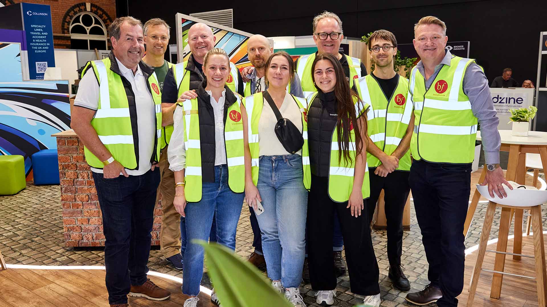 The brandformula team posing for a photo after building a conference stand