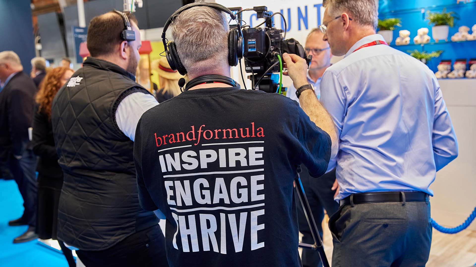 Signage being attached to a conference stand