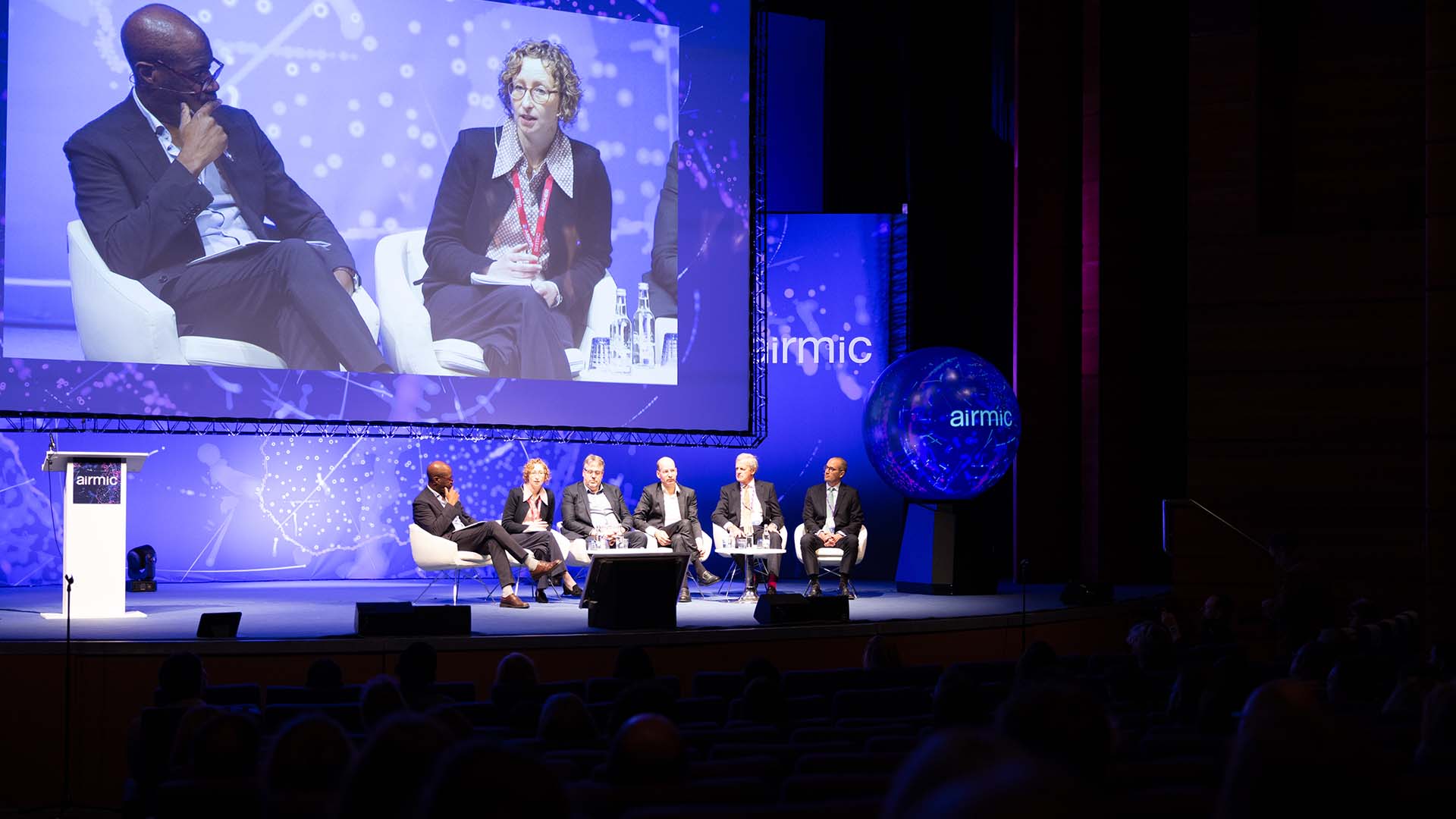 Group playing game at a conference stand