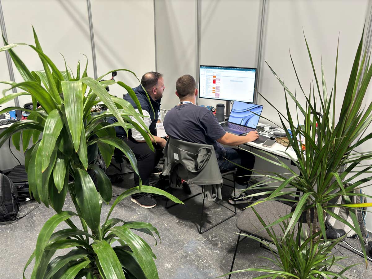 People networking and having discussions on a conference stand