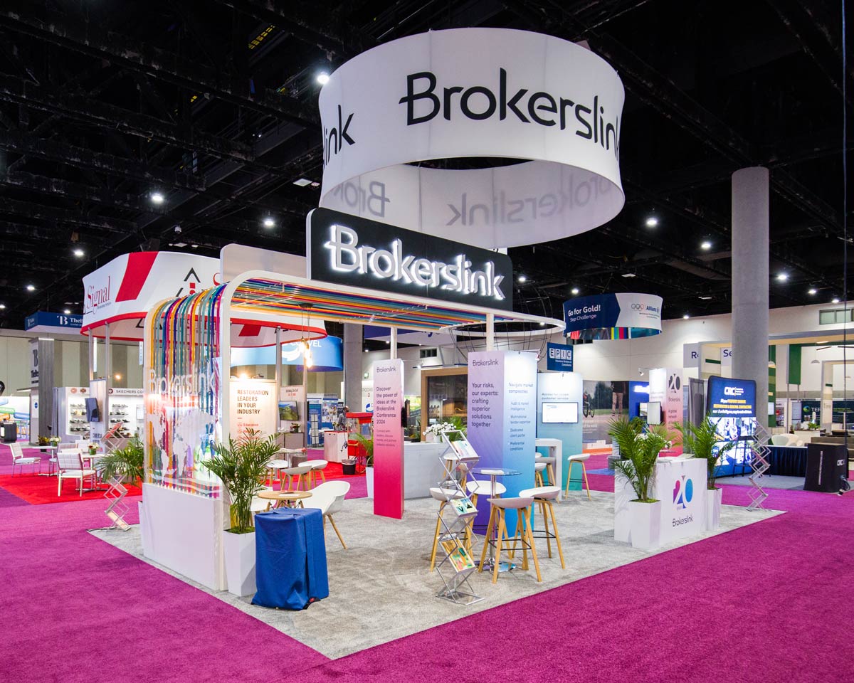 People networking and having discussions on a conference stand