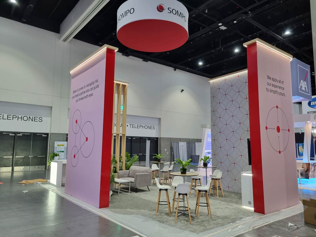 People networking and having discussions on a conference stand