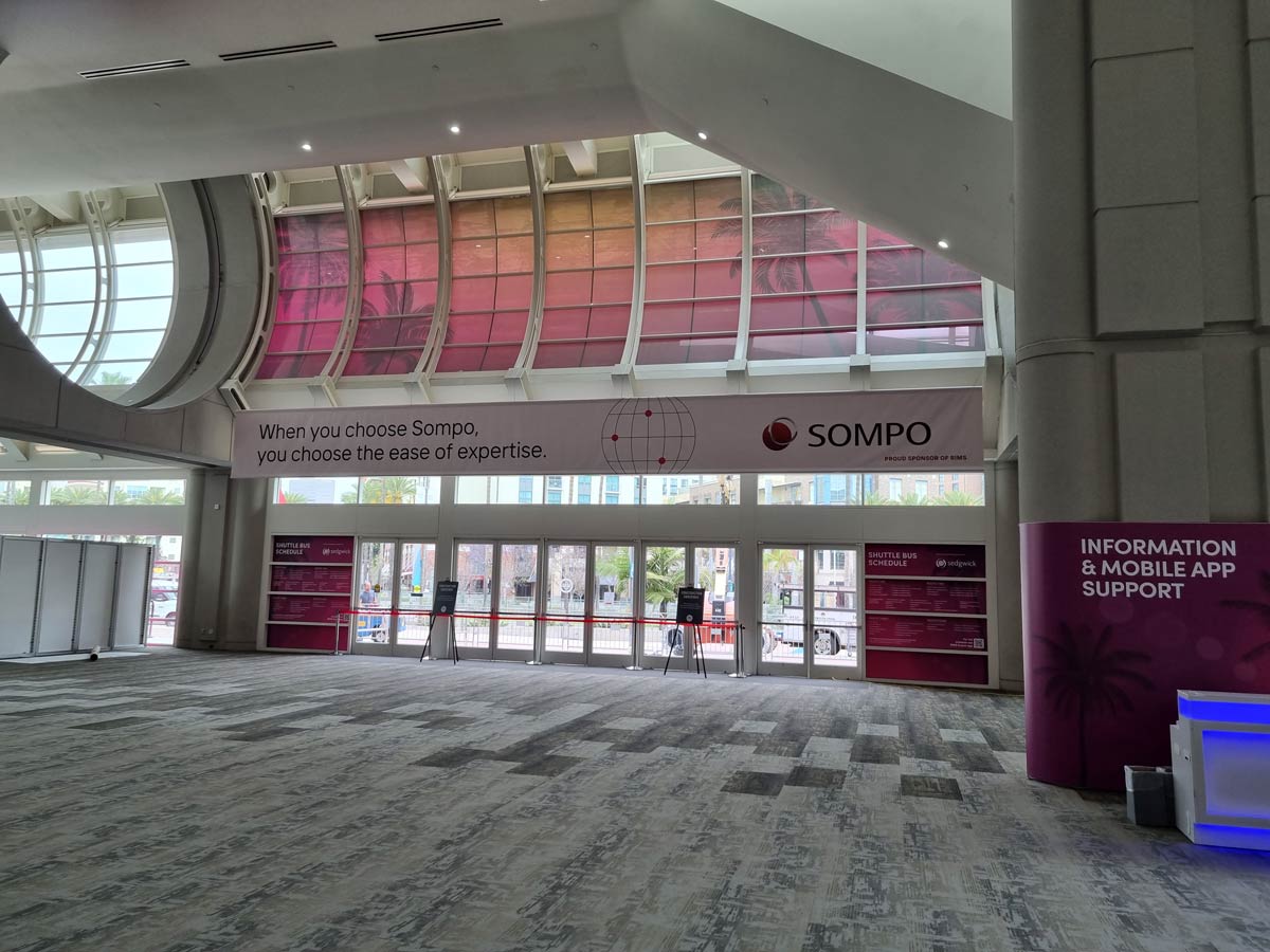 People networking and having discussions on a conference stand