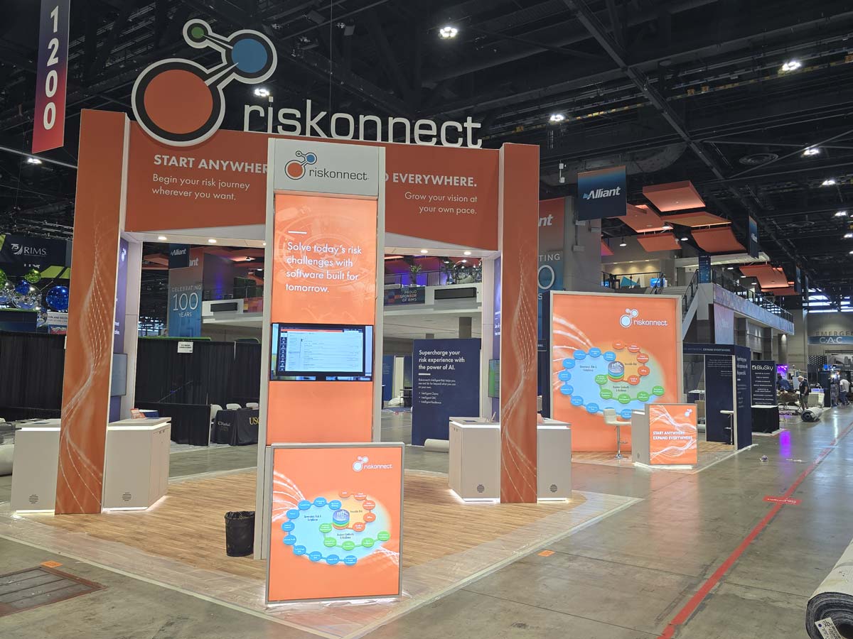 People networking and having discussions on a conference stand