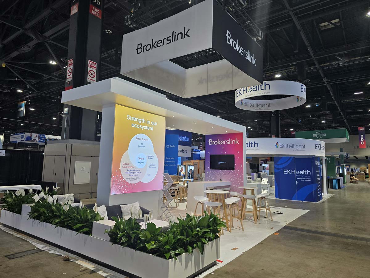 People networking and having discussions on a conference stand