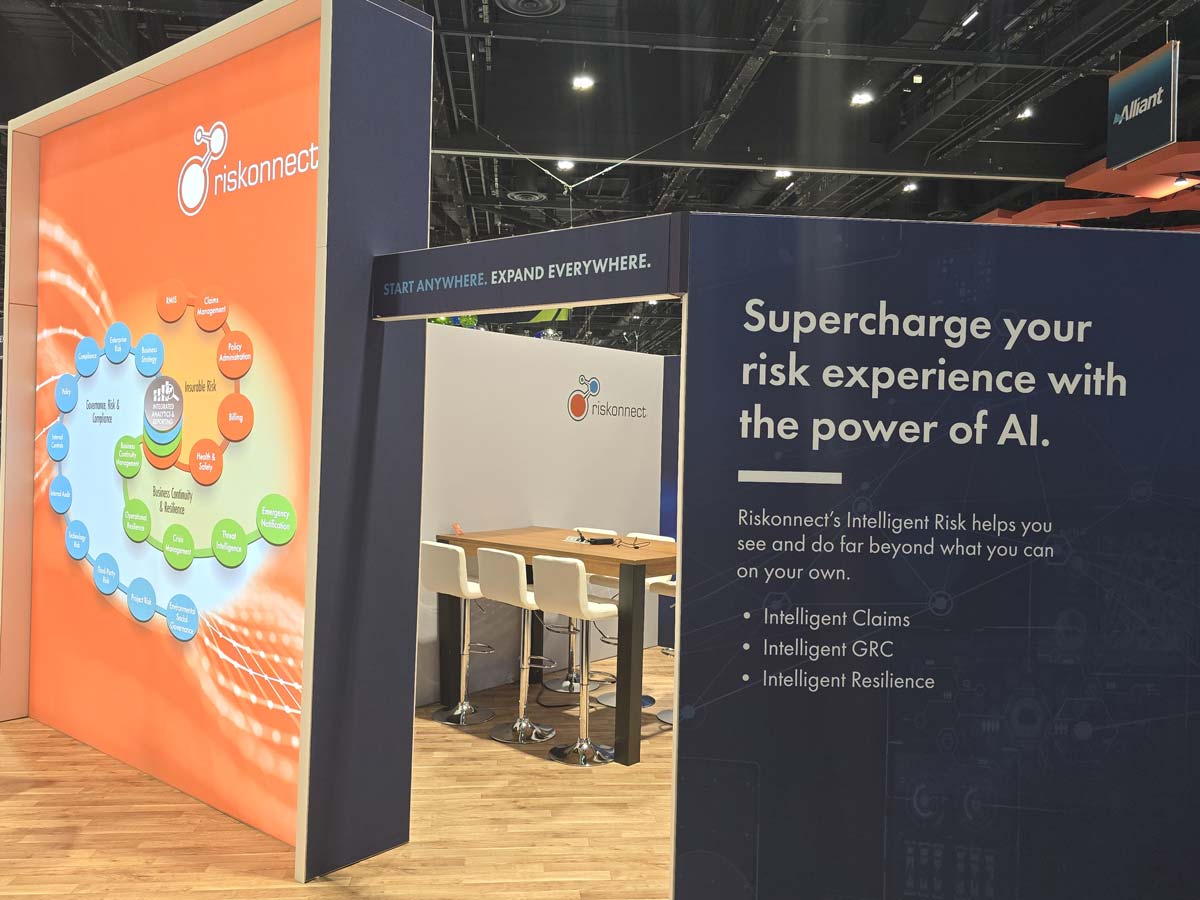 People networking and having discussions on a conference stand