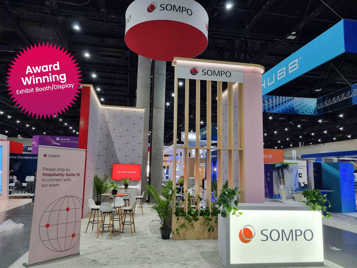 People networking and having discussions on a conference stand