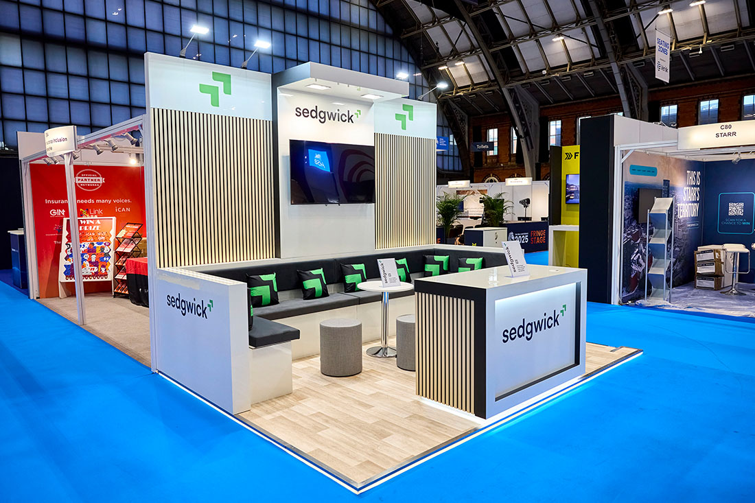 People networking and having discussions on a conference stand