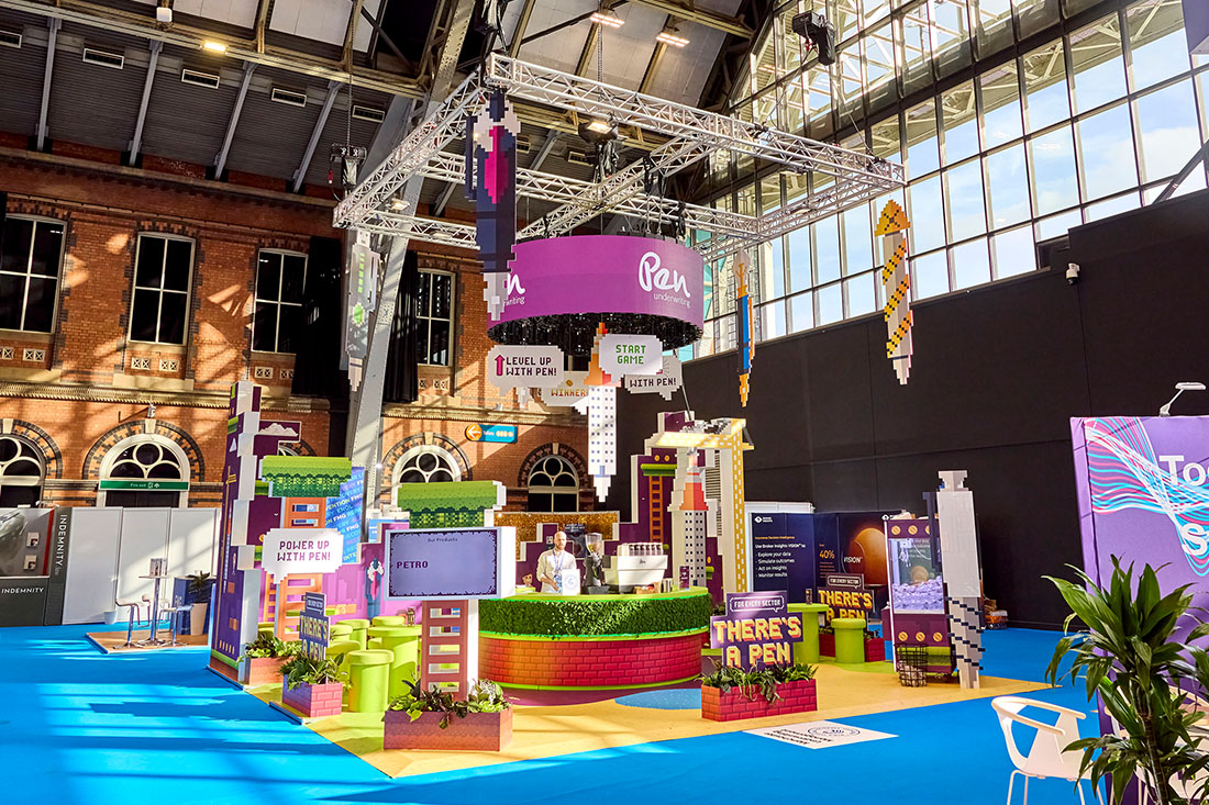 People networking and having discussions on a conference stand