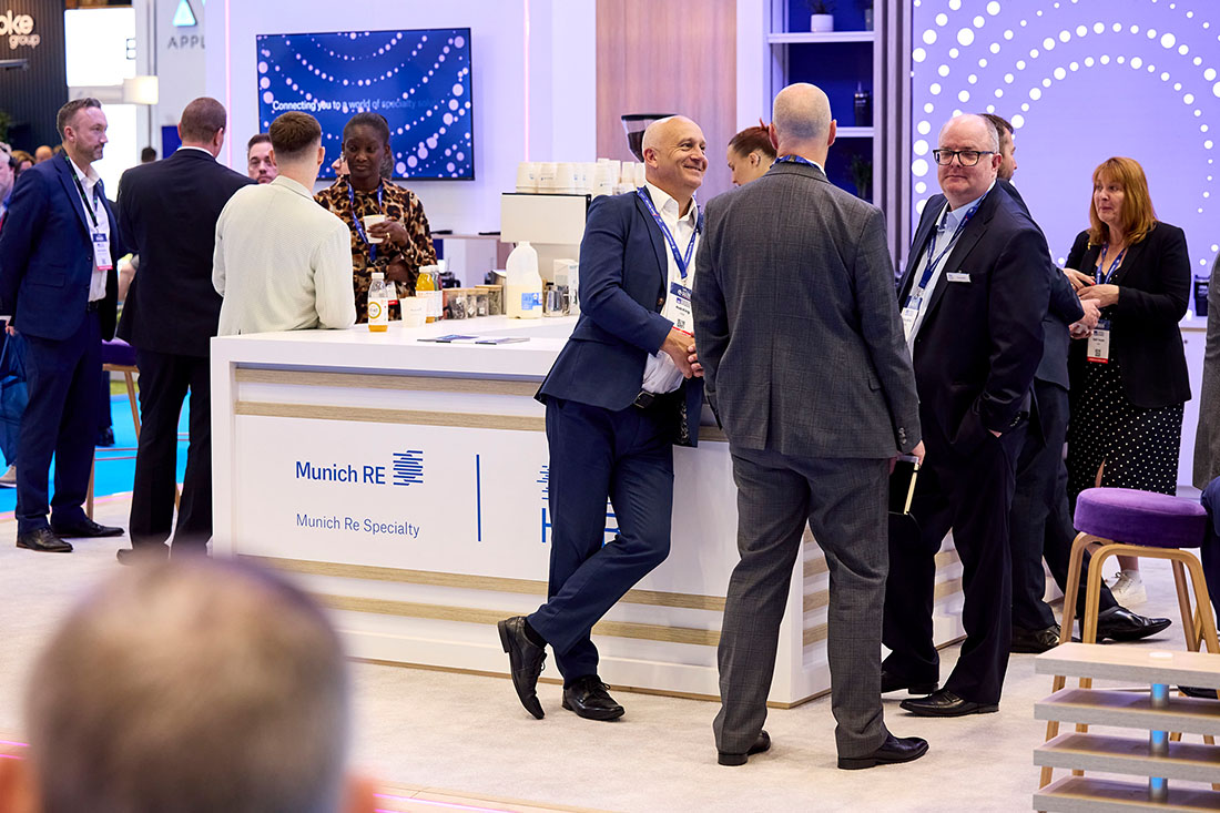People networking and having discussions on a conference stand