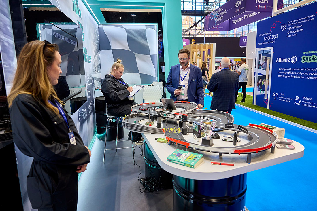 People networking and having discussions on a conference stand