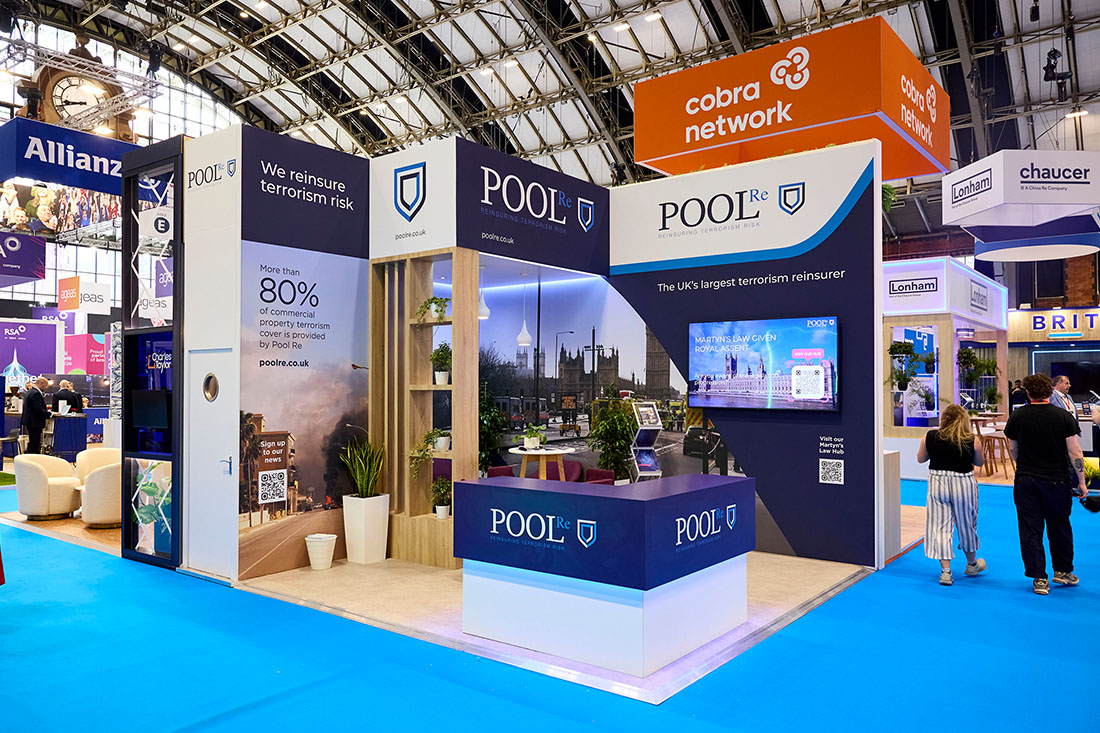 People networking and having discussions on a conference stand