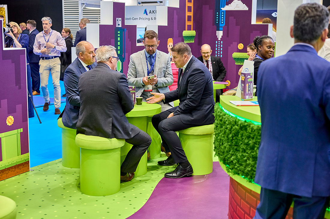 People networking and having discussions on a conference stand