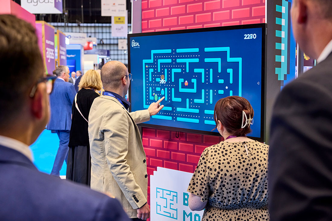 People networking and having discussions on a conference stand