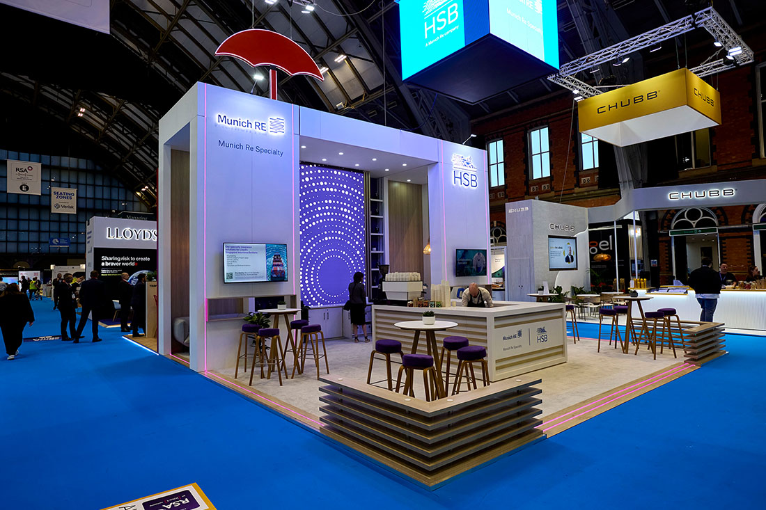 People networking and having discussions on a conference stand