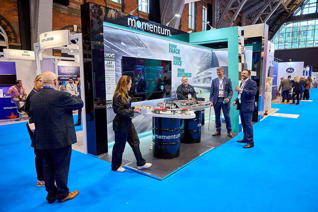 People networking and having discussions on a conference stand