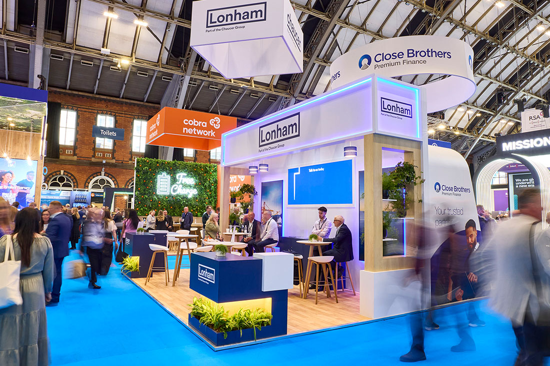 People networking and having discussions on a conference stand