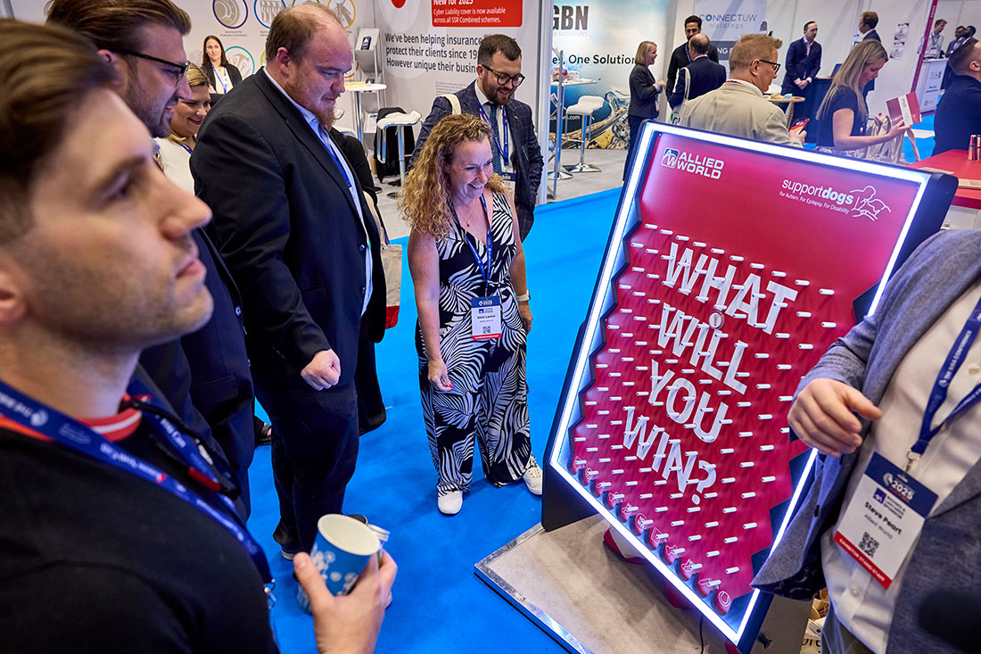 People networking and having discussions on a conference stand