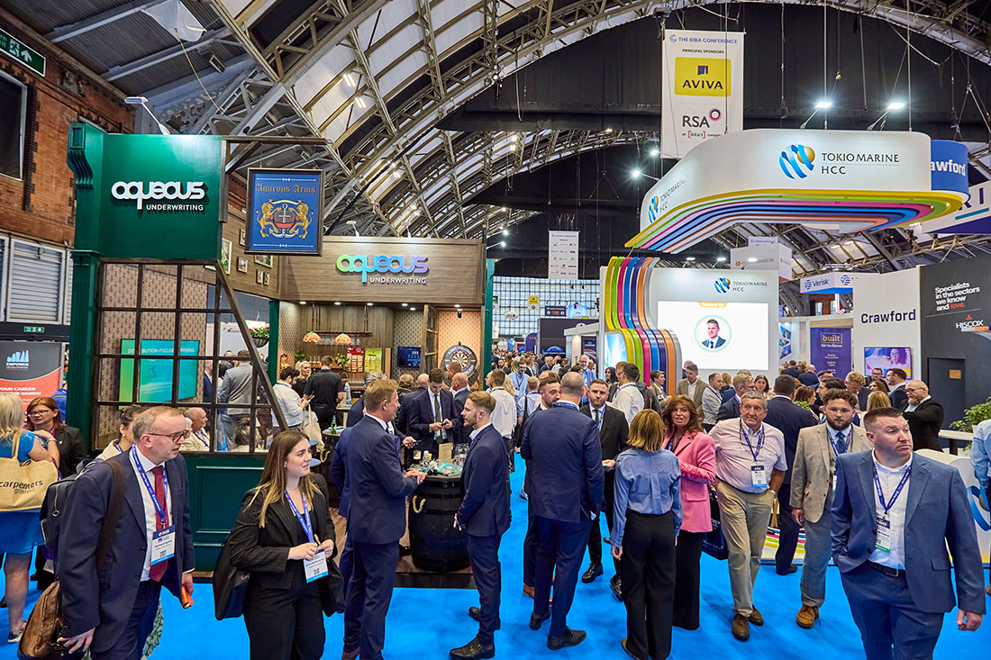 People networking and having discussions on a conference stand