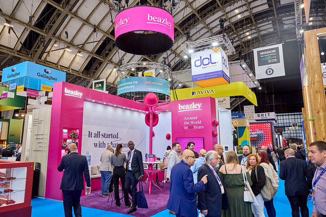 People networking and having discussions on a conference stand
