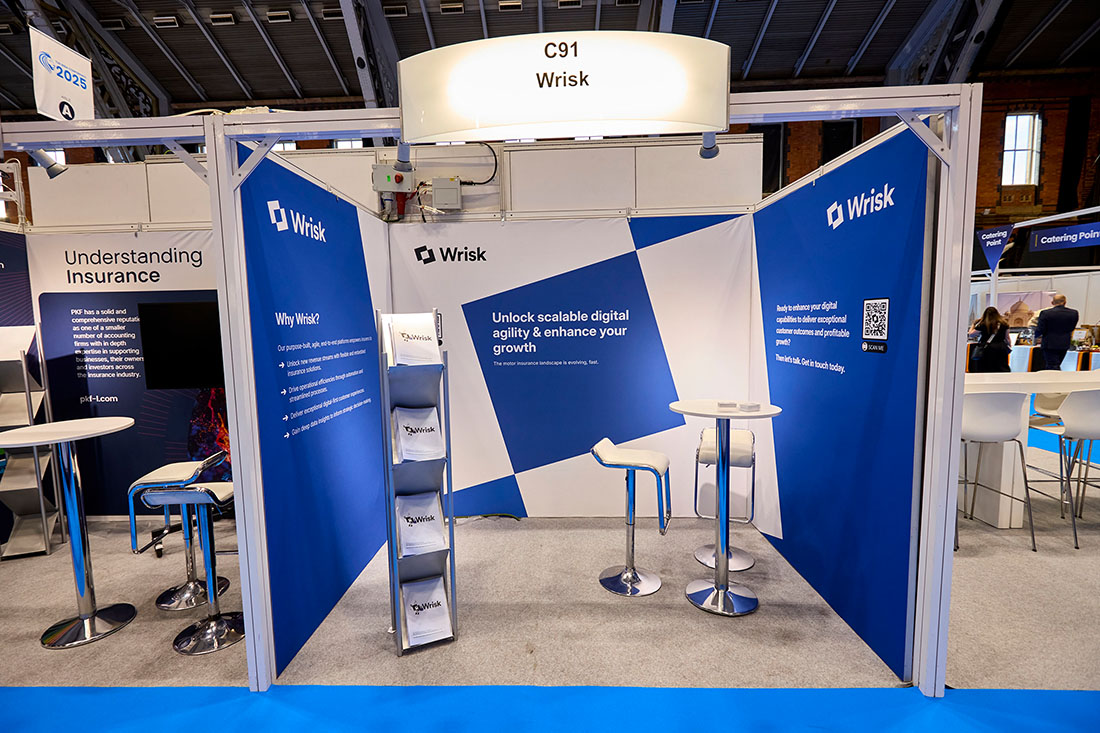 People networking and having discussions on a conference stand