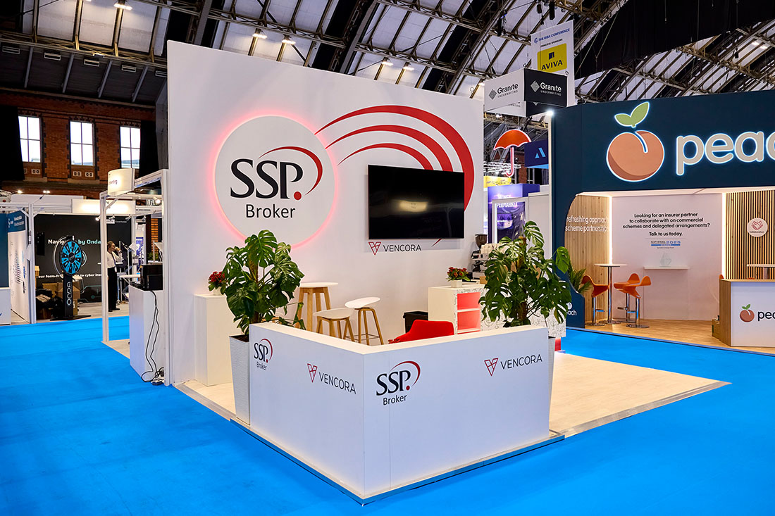 People networking and having discussions on a conference stand