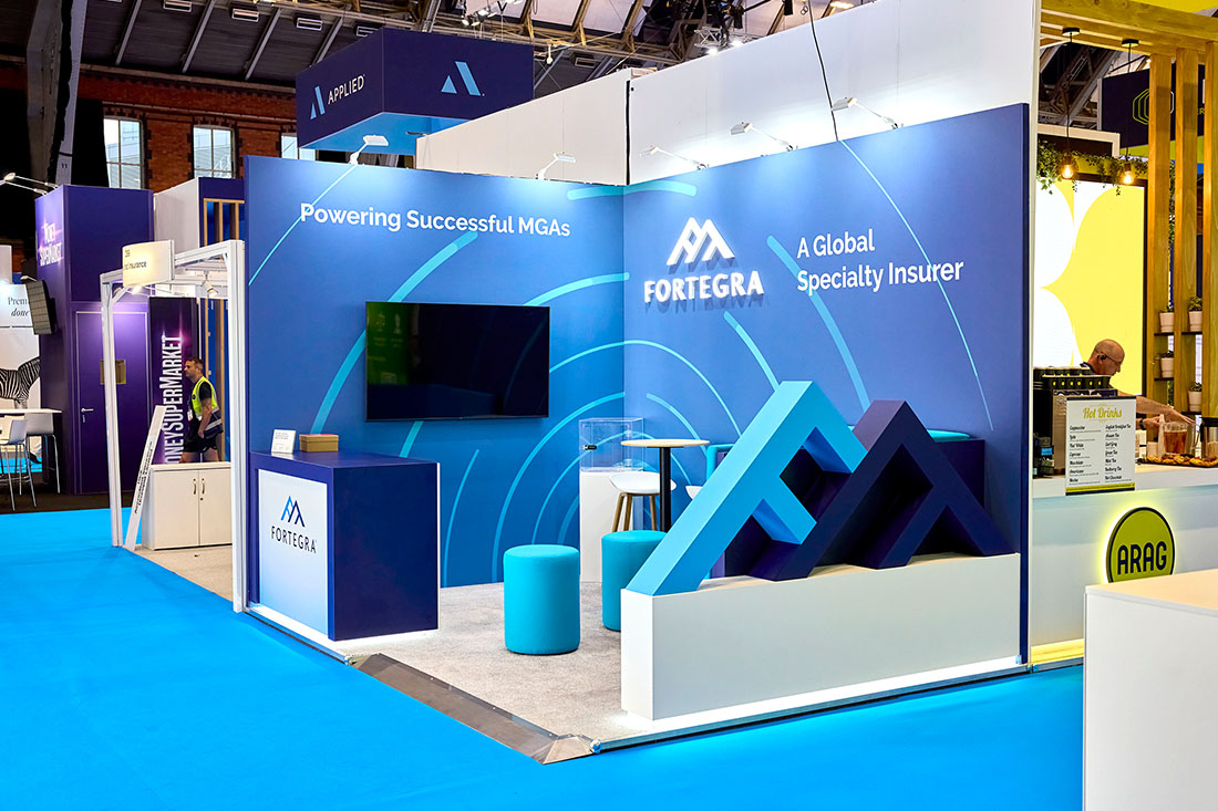 People networking and having discussions on a conference stand