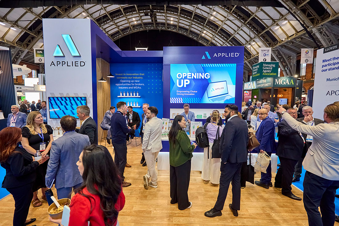 People networking and having discussions on a conference stand
