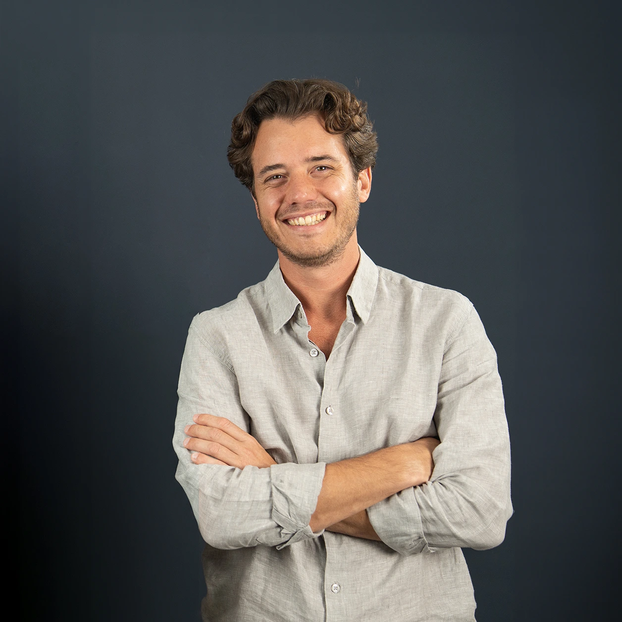 A studio portrait photo of Carlos Puig