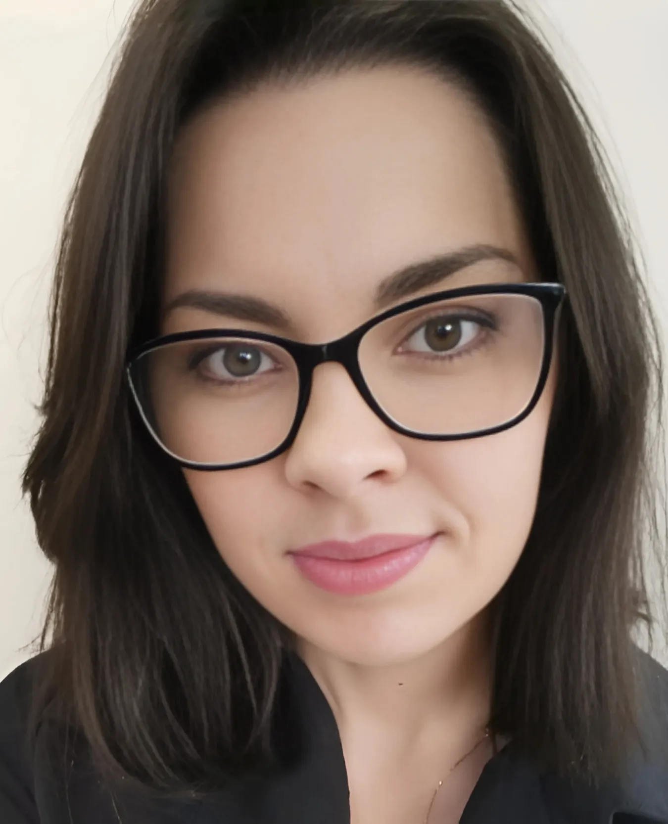 Simona Germonienė, Business Analyst at Teida, facing camera with a slight smile, dark shoulder-length hair, wearing glasses and a dark top.
