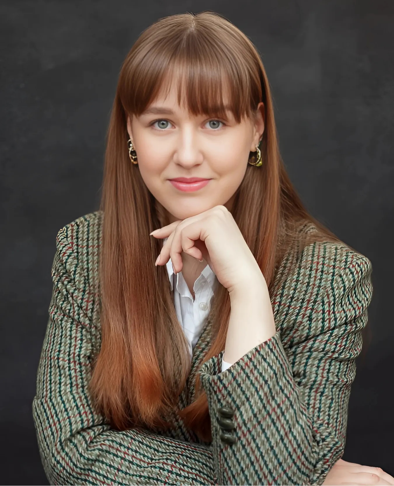 Paulina Steponaviciute, Activities Coordinator at the Red Cross, facing camera with a neutral expression, long light brown hair, wearing a checked jacket.
