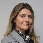 Sandra Datenė, Head of Customer Care Unit, shoulder-level portrait, light blazer, neutral facial expression, looking toward camera