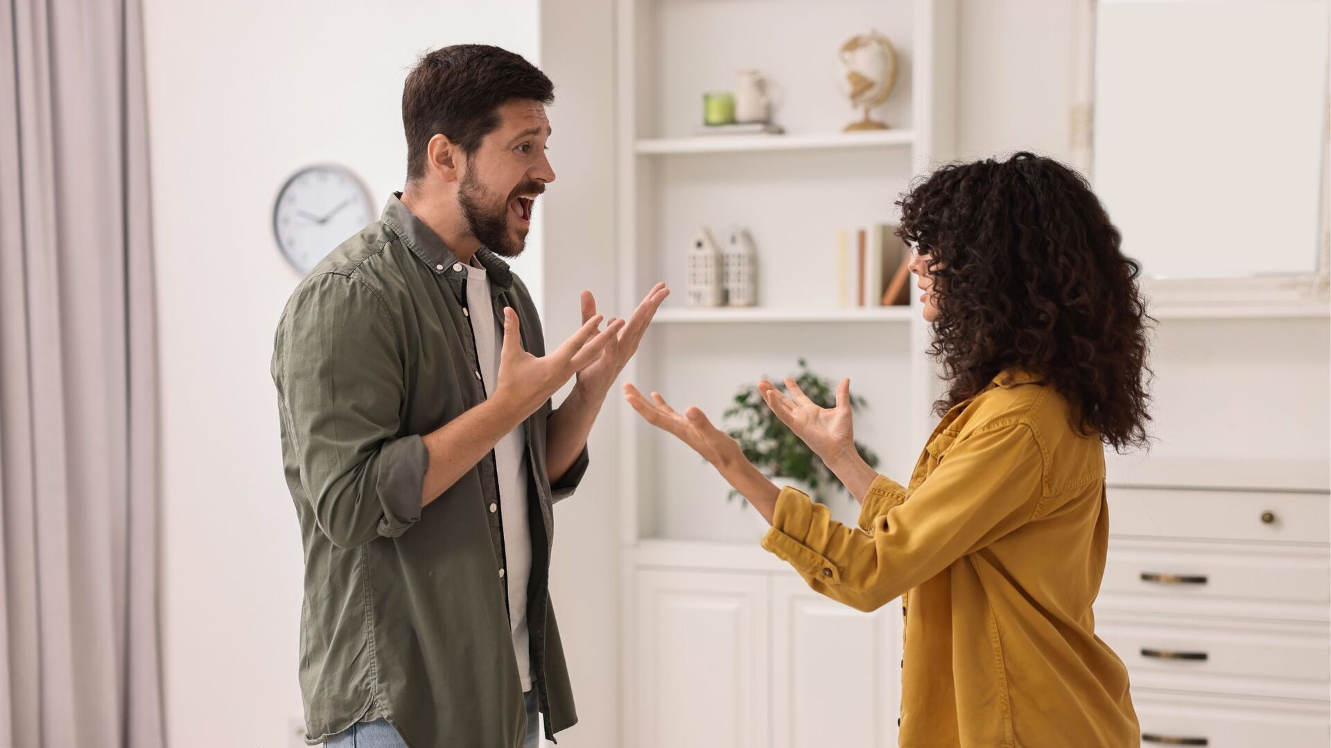 Couple arguing with gestures, showing conflict and miscommunication.