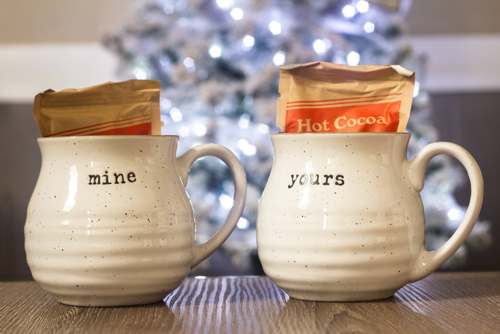 Two cups labeled "Mine" and "Yours," symbolizing personal space, individuality, and healthy boundaries within a relationship.