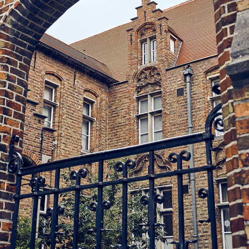 large mansion in highgate with black metal gate