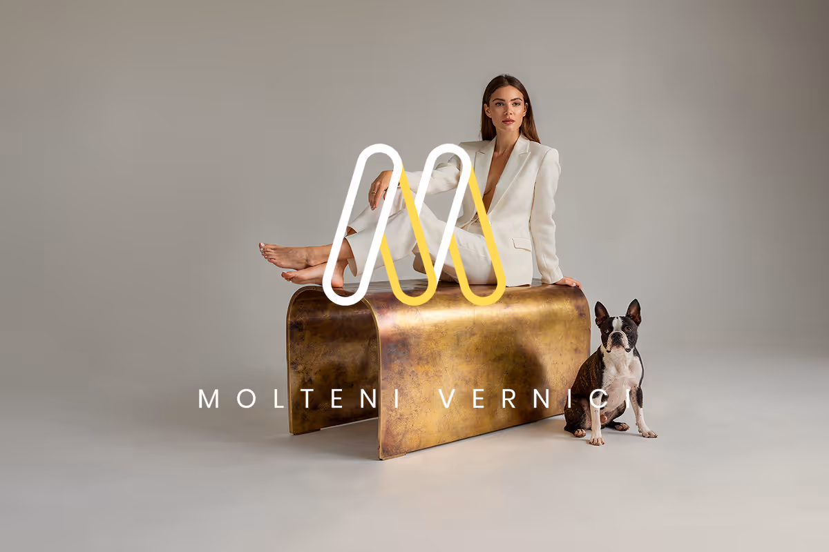 Luxury architectural metal finish by Molteni Vernici applied on a sculptural brass furniture piece with contemporary design.