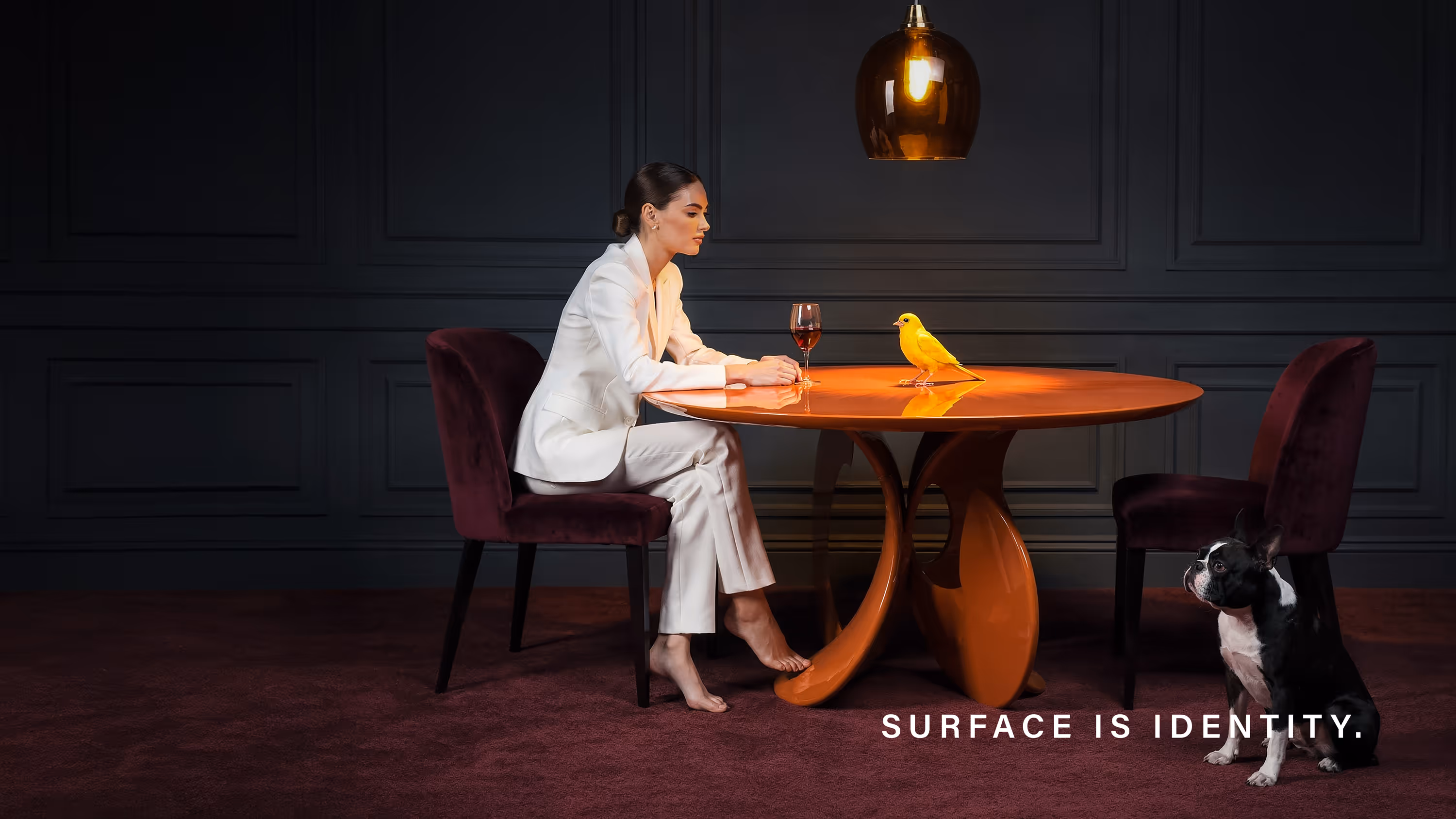 Luxury interior with glossy and matte surface finishes on designer table highlighting color depth and material identity in contemporary design