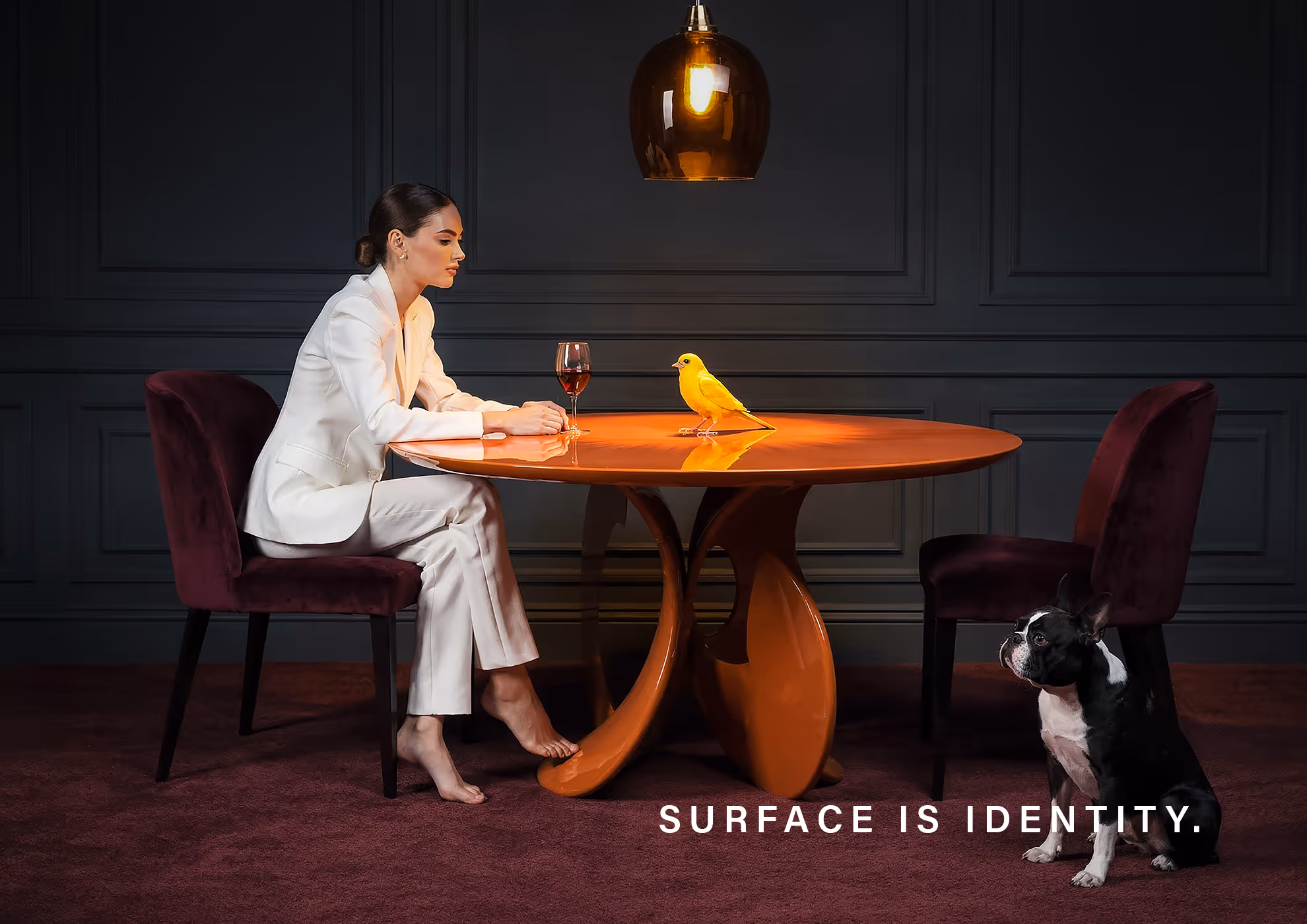 Luxury interior with glossy and matte surface finishes on designer table highlighting color depth and material identity in contemporary design