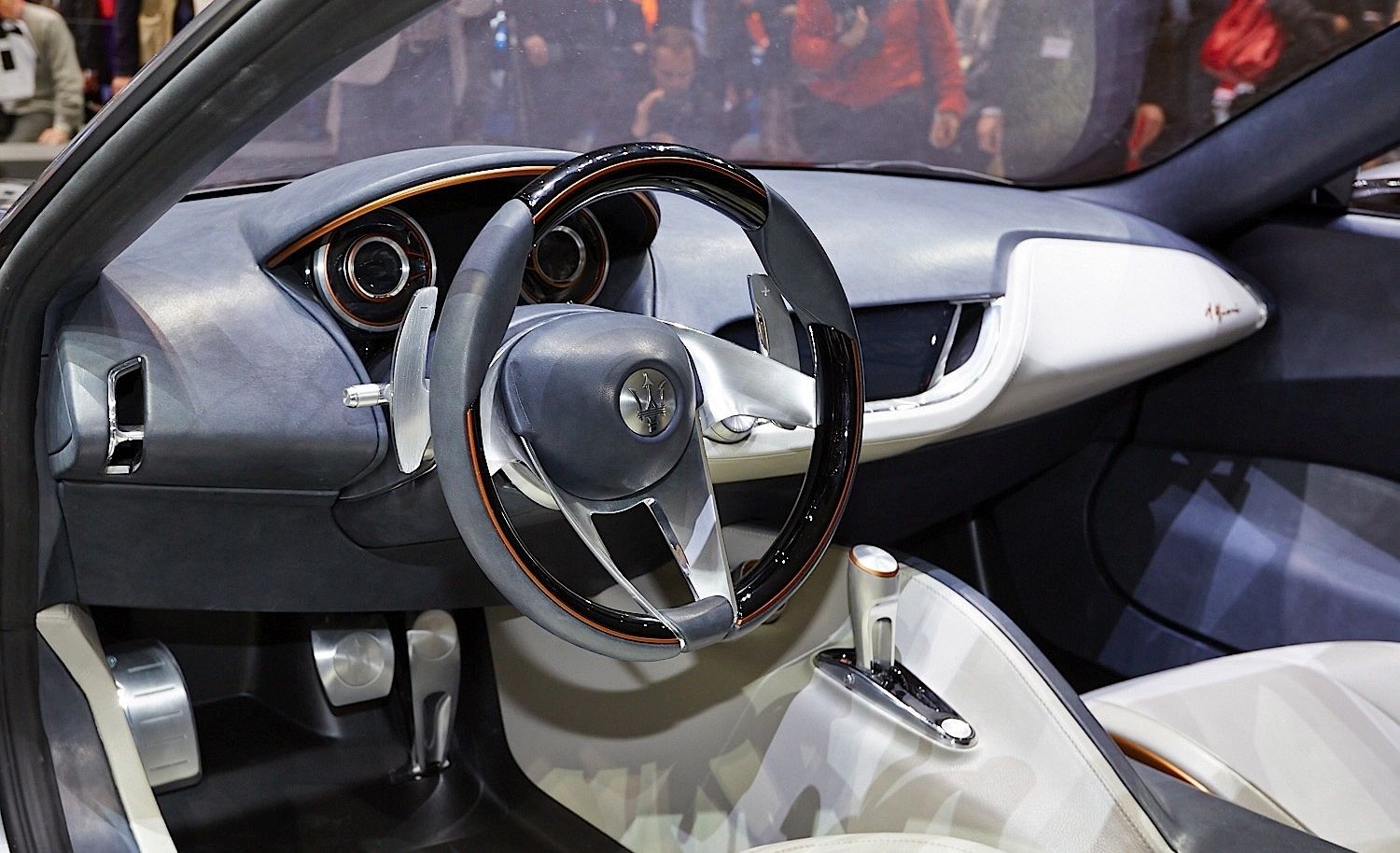 Maserati luxury car interior with sleek steering wheel and dashboard