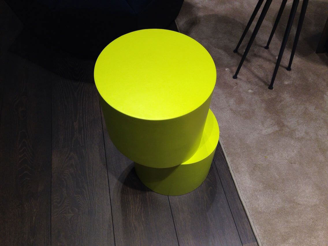 Bright yellow MOLTENI VERNICI special paints side table on wooden floor
