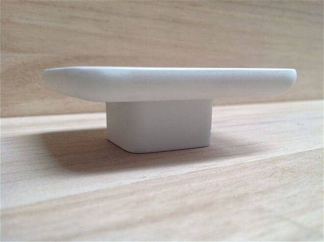 MOLTENI, VERNICI special paints minimalist white ceramic pedestal on wood surface