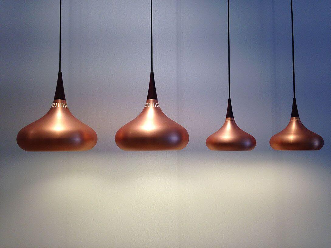 MOLTENI VERNICI special paints illuminate copper pendant lights artfully arranged
