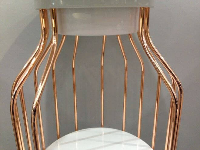 MOLTENI VERNICI special paints create elegant copper-toned chair with curved design