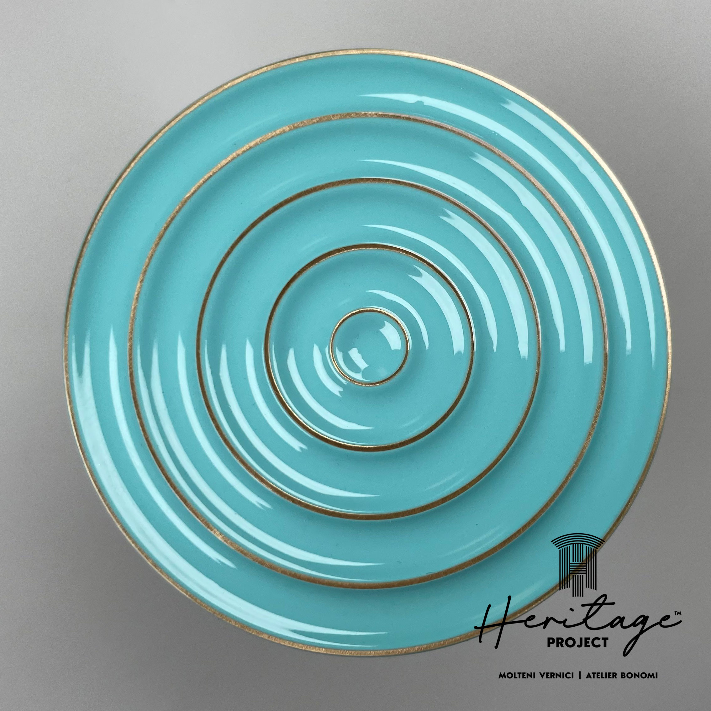 Assiette turquoise MOLTENI-VERNICI avec cercles concentriques dorés pour design