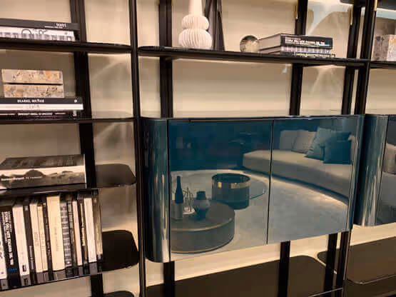 MOLTENI-VERNICI special effect finishes on sleek blue-green shelving display
