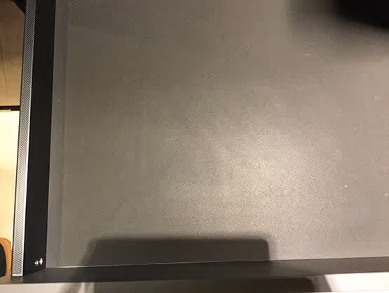 Acabados MOLTENI-VERNICI: superficie gris metálica con sombra suave