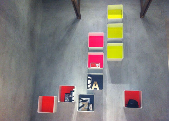 MOLTENI-VERNICI fluo paint color blocks displayed on minimalist gray surface