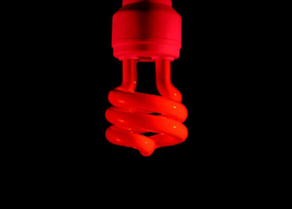 MOLTENI-VERNICI fluo paint dripping in vibrant red against black background