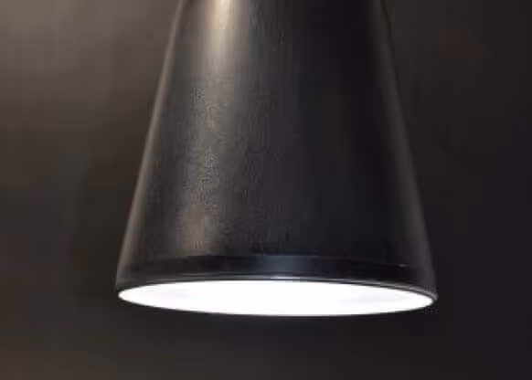 MOLTENI-VERNICI sleek black lamp with dramatic paint effect lighting